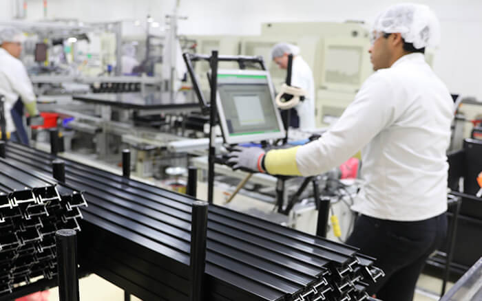 Workers in Mexicali Solar Panel Plant